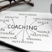 Coaching concept sheet showing goals, skills, and motivation connected to mentoring and training, representing how Noomii helps people find the right coach in 2025.