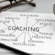 Coaching concept sheet showing goals, skills, and motivation connected to mentoring and training, representing how Noomii helps people find the right coach in 2025.